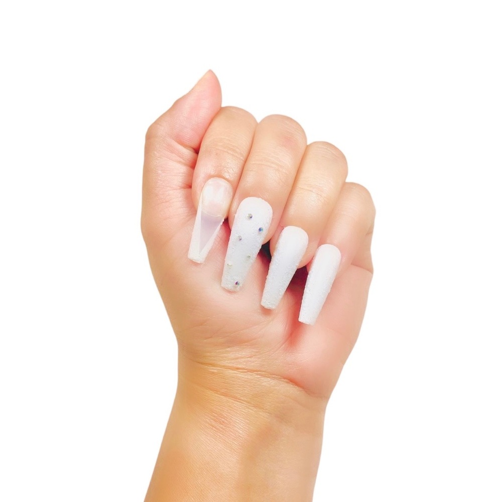 Long coffe nails white diamond.